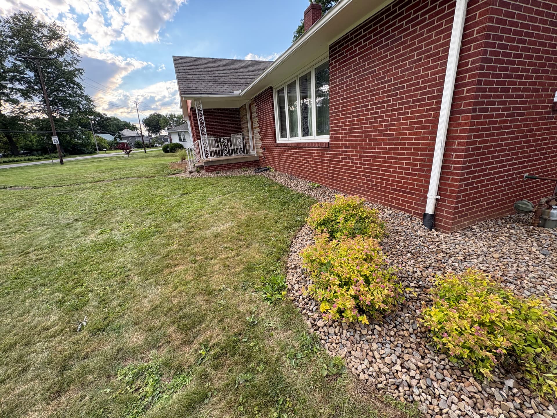 Overgrown Flower Bed Torn Out and Rebuilt With Rock and New Plants image