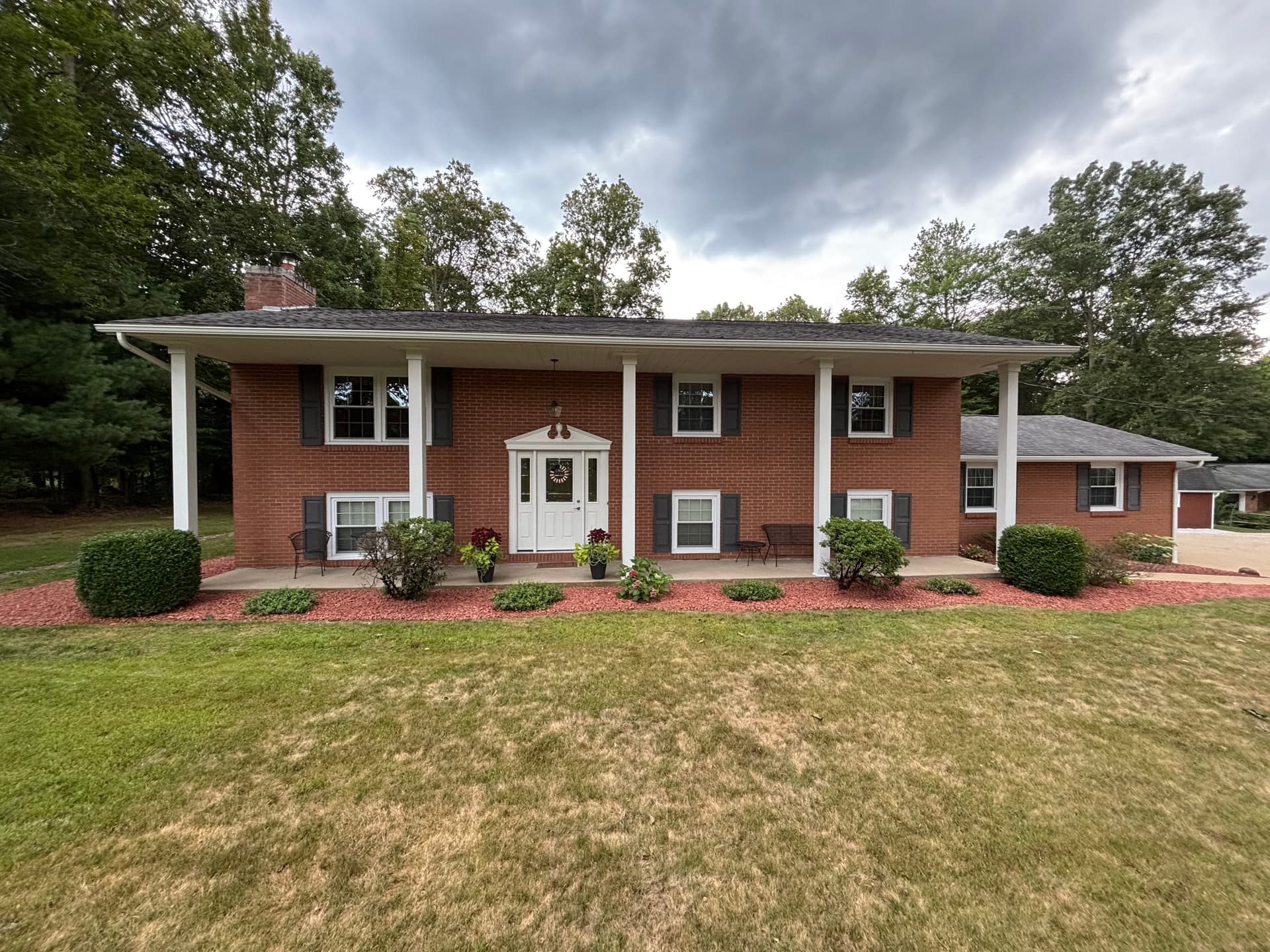 Fresh Red Brick Chips and New Gravel Stone Around This Home image