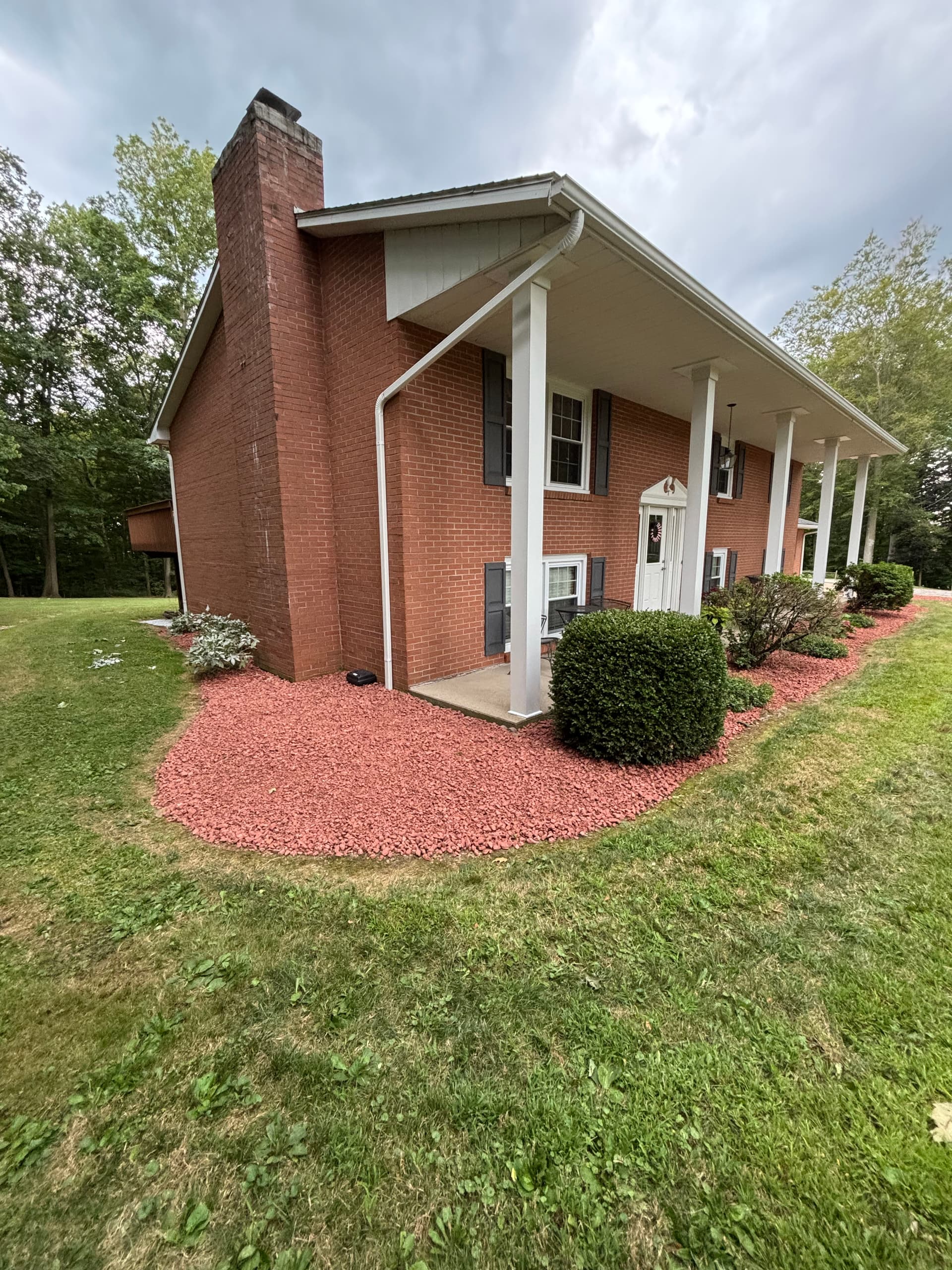Gallery photos for Fresh Red Brick Chips and New Gravel Stone Around This Home: Image #2